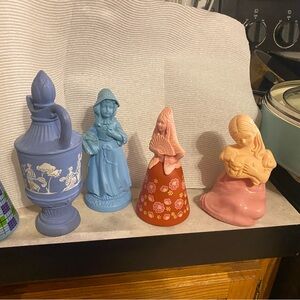 Avon bottles…. one is full of perfume other are empty to having some.